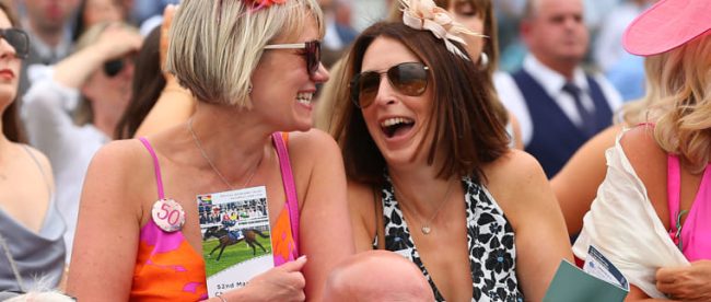 Two women watching the racing at Ladies Day in York