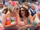 Two women watching the racing at Ladies Day in York